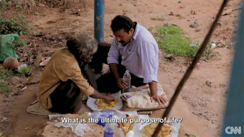 Narayanan Krishnan feeding a homeless man